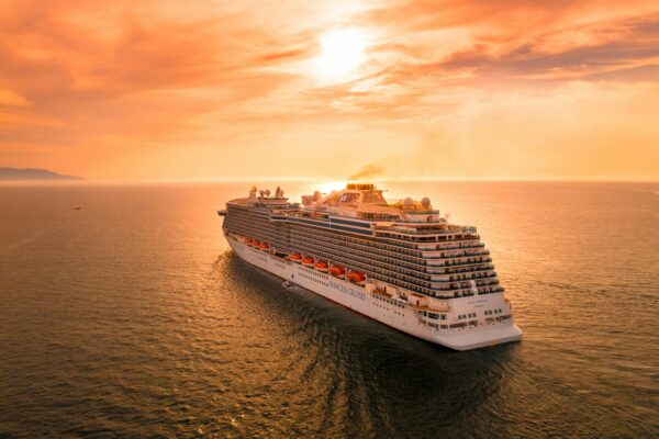 Modern cruise ship sailing at sunset - photo by Alonso Reyes on Unsplash